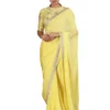 Yellow floral thread work blouse with sequin detail. Paired with embroidered hem saree.